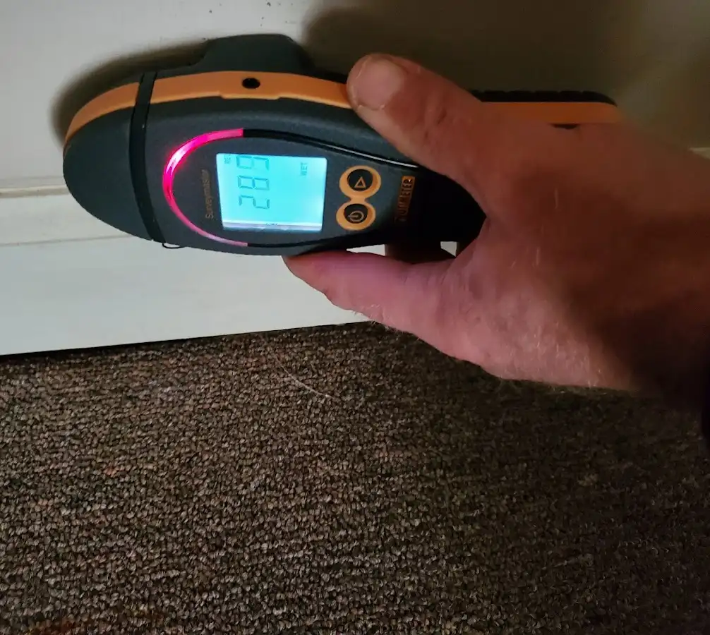 Moisture detection at baseboard during Storm Damage Restoration in Anthem